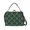 Kisslock crossbody bag with green arches and purple keyhole pattern, front view with handle and shoulder strap
