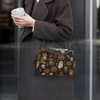 Model wearing kisslock bag with autumn ghosts, pumpkins, and woodland animal print at her side