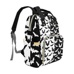 Black & White Bats Backpack left three-quarter view showing side pocket and front zipper