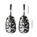 Two side profiles of kisslock bag with black and white bat pattern beside dimension markers