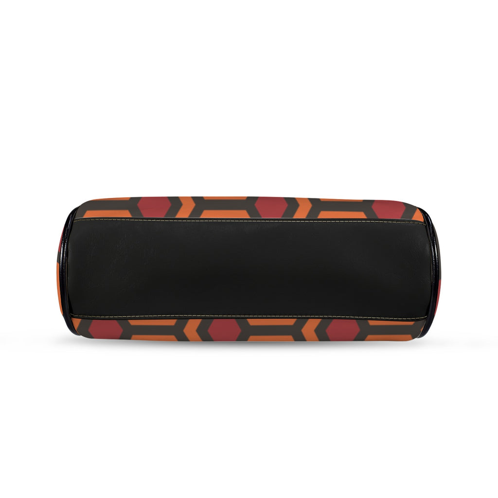 Underside of kisslock bag with burnt-orange and red Haunted Hotel geometric print and black bottom panel