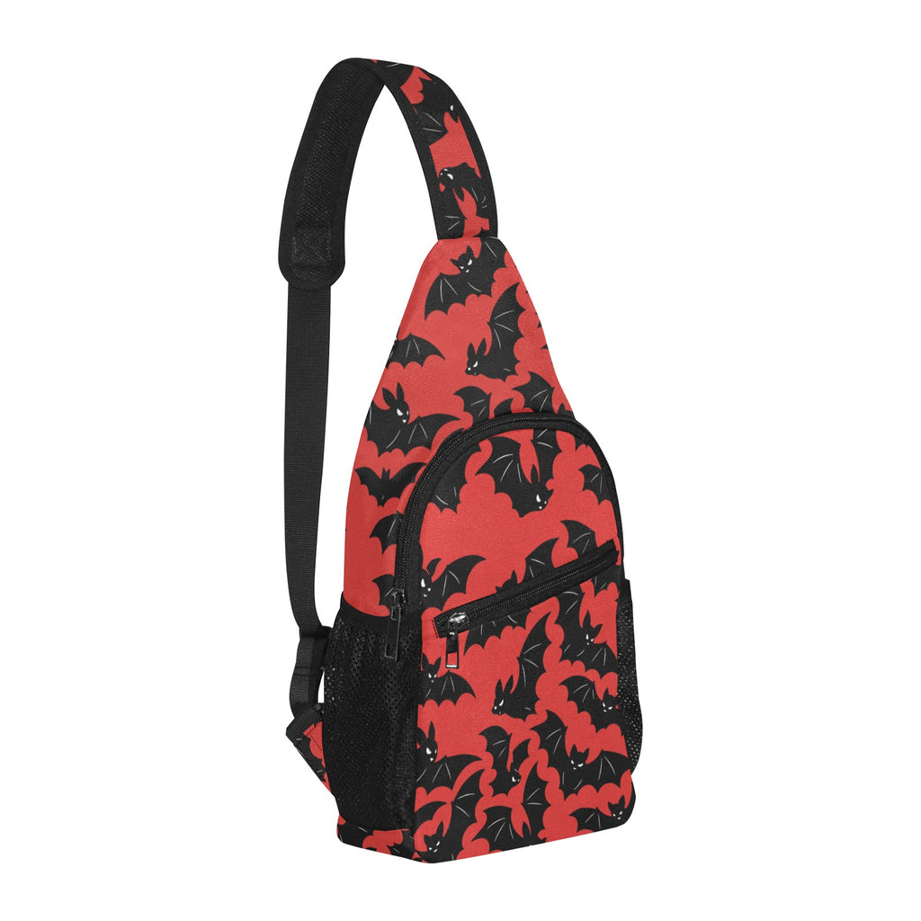 Opposite three-quarter view of chest bag with red and black bat pattern and shoulder strap