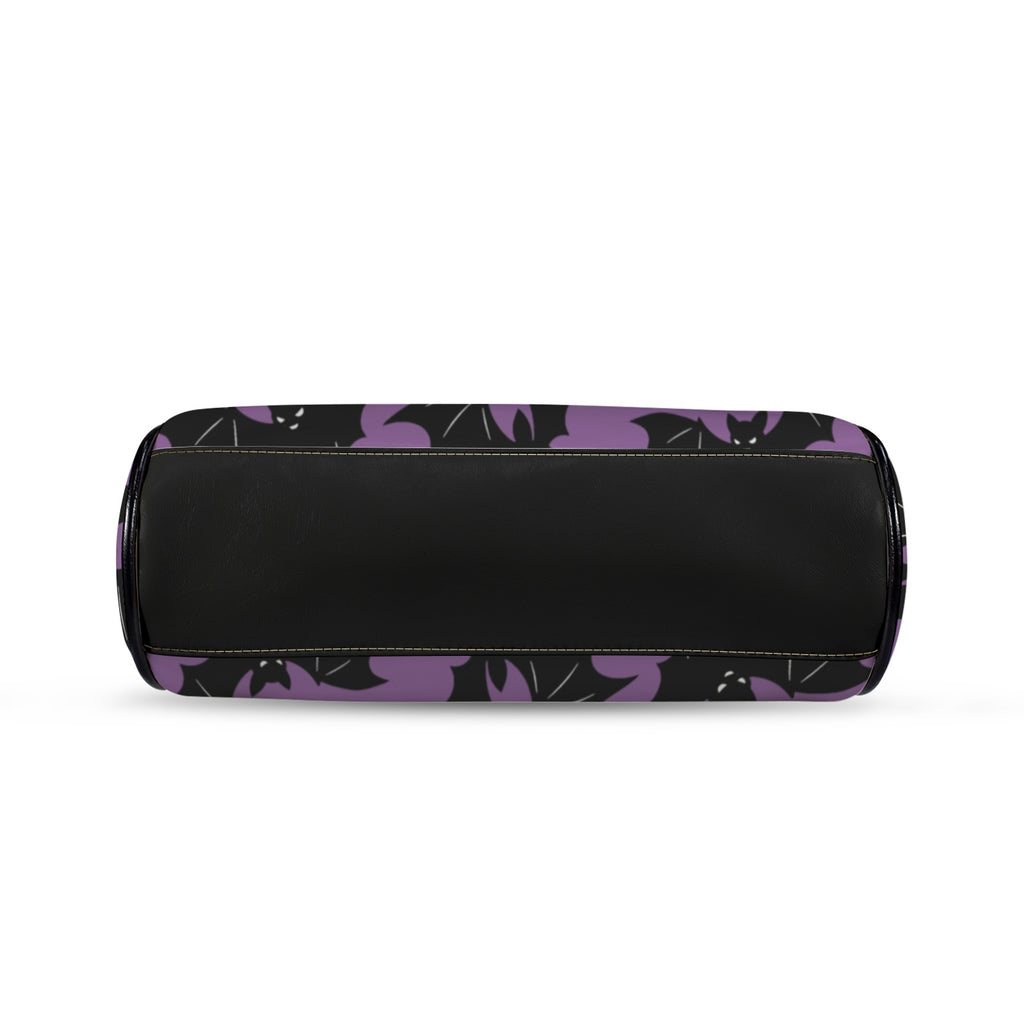 Underside of kisslock bag with purple and black bat pattern and black bottom panel