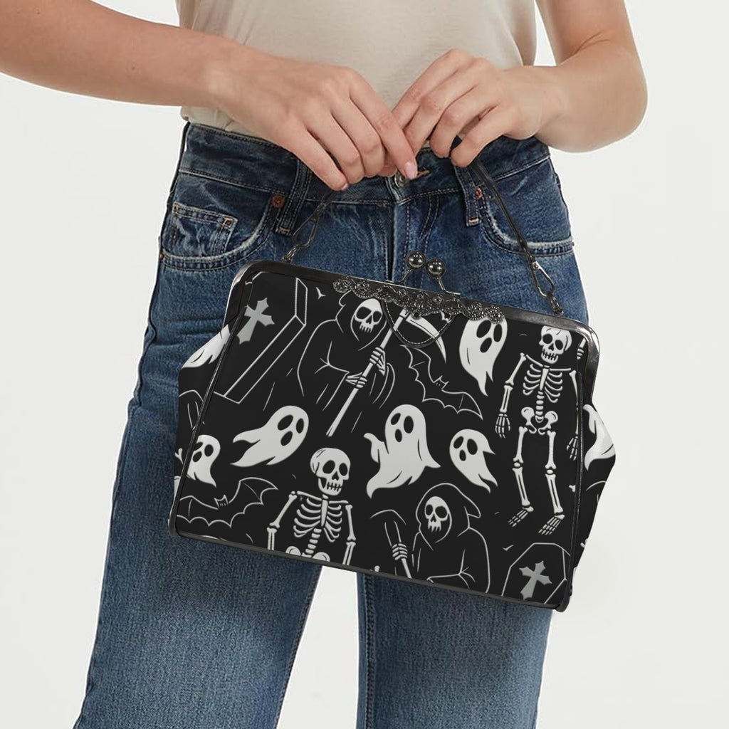 Model carrying kisslock bag with white ghosts and grim reapers on black by the top handle