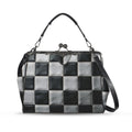 Kisslock crossbody bag with black and white checkerboard pattern, front view with handle and shoulder strap