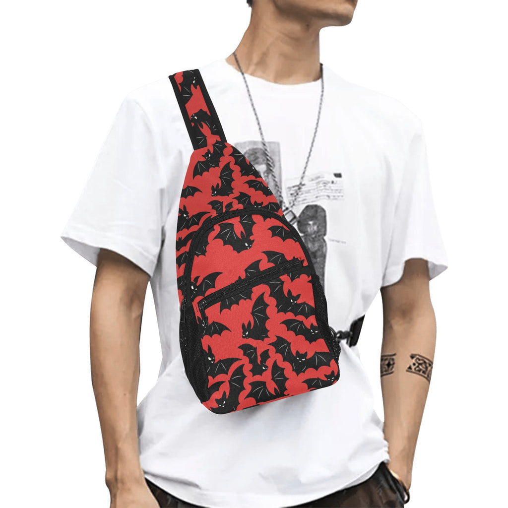 Model wearing crossbody chest bag with red and black bat pattern