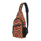 Three-quarter view of chest bag with burnt-orange and red Haunted Hotel geometric print, front pocket and side mesh