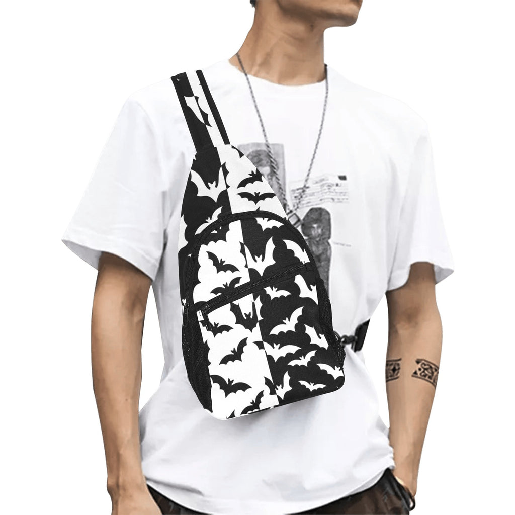 Model wearing crossbody chest bag with black and white bat pattern