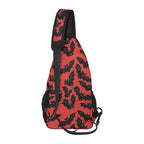 Side profile of chest bag with red and black bat pattern and adjustable shoulder strap
