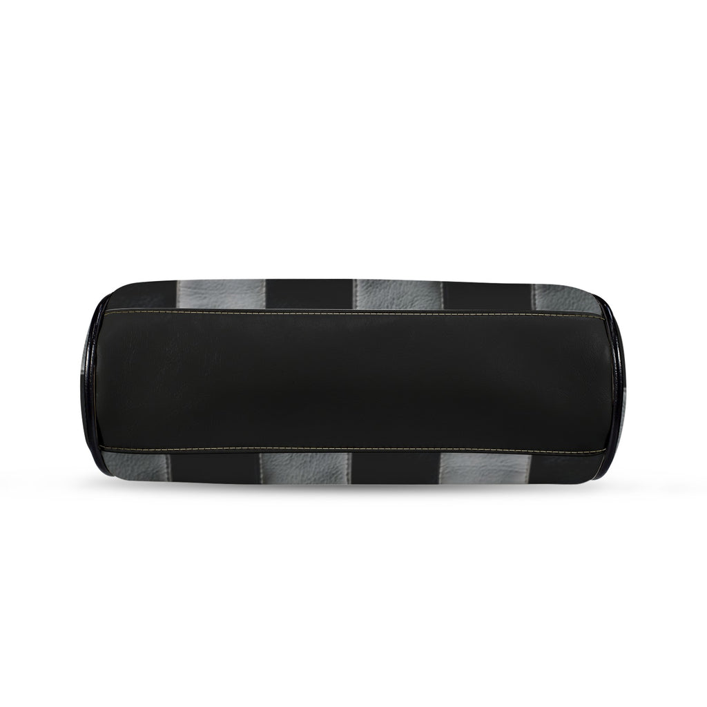 Underside of kisslock bag with black and white checkerboard pattern and black bottom panel