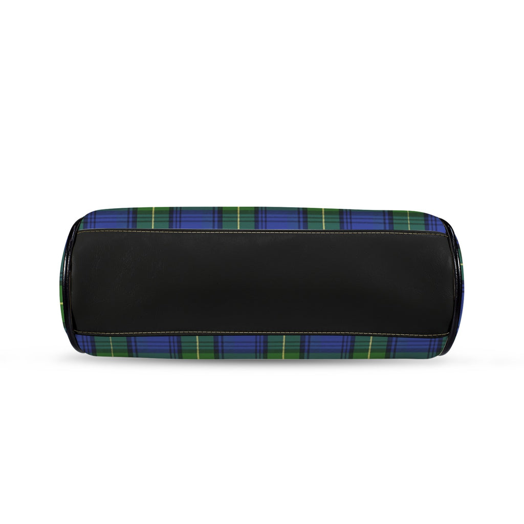 Underside of kisslock bag with blue and green plaid pattern and black bottom panel