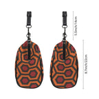 Two side profiles of kisslock bag with burnt-orange and red Haunted Hotel geometric print beside dimension markers