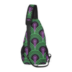 Side profile of chest bag with green arches and purple keyhole pattern and adjustable shoulder strap