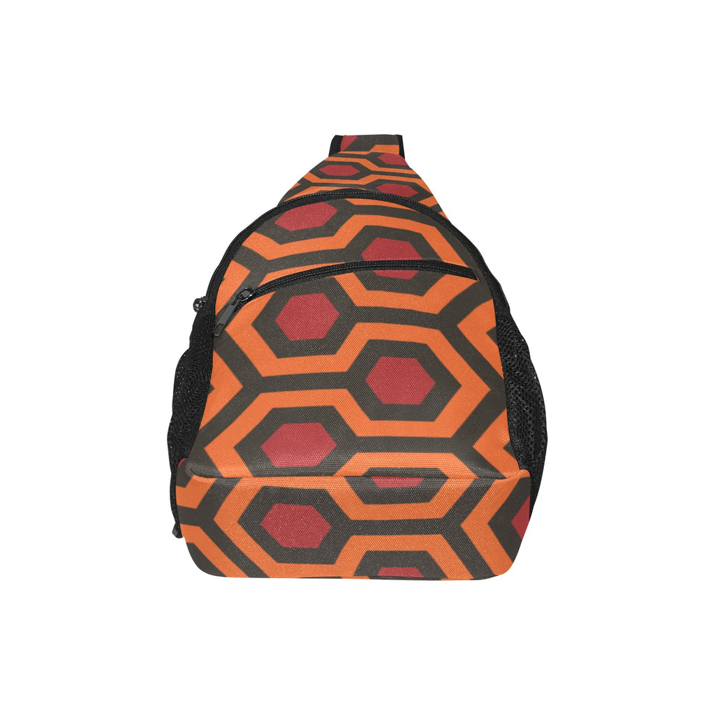 Broad panel of chest bag with burnt-orange and red Haunted Hotel geometric print and curved zippered pocket