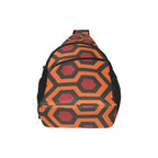 Broad panel of chest bag with burnt-orange and red Haunted Hotel geometric print and curved zippered pocket