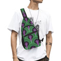 Model wearing crossbody chest bag with green arches and purple keyhole pattern