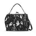 Kisslock crossbody bag with white ghosts and grim reapers on black, front view with handle and shoulder strap