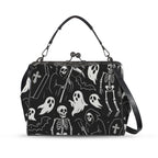 Kisslock crossbody bag with white ghosts and grim reapers on black, front view with handle and shoulder strap