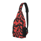 Three-quarter view of chest bag with red and black bat pattern, front pocket and side mesh